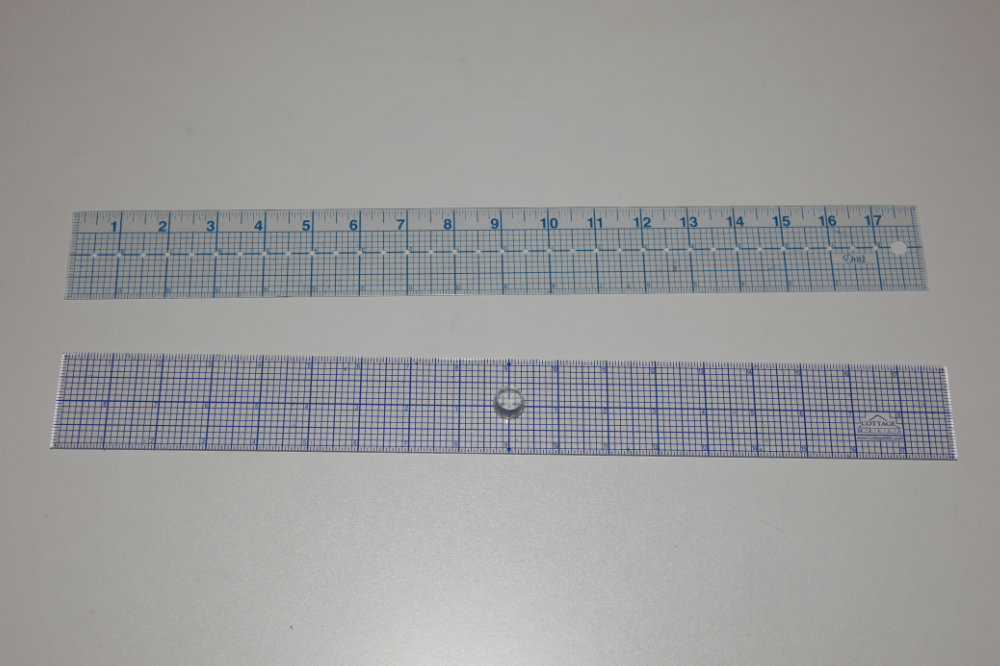 Two 2-inch clear rulers 18 inches long