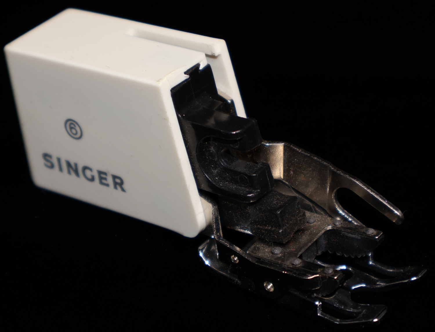Walking foot Attachment for a singer sewing machine.