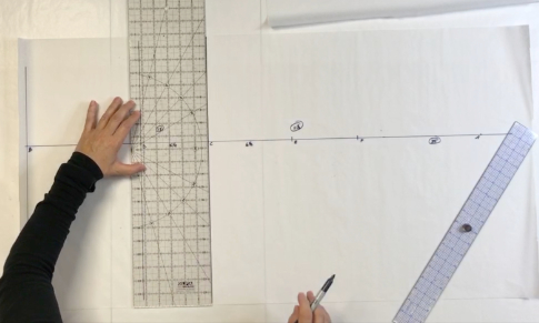 Drafting photo still from video included in the course for drafting a legging pattern.